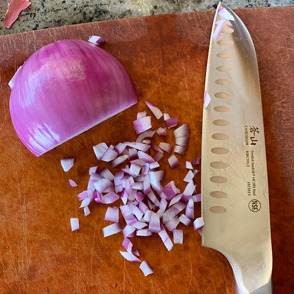 red onion chopped for Spicy Shrimp Tacos with Orange and Grape Salsa